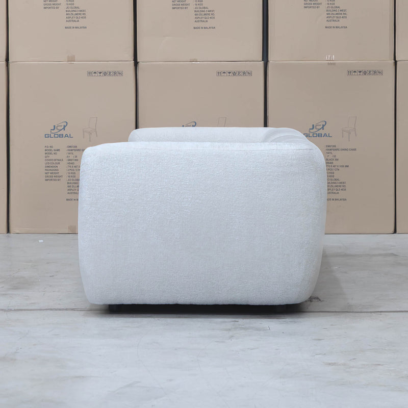 The Fara Curved Fabric Four Seat Sofa - Cloud available to purchase from Warehouse Furniture Clearance at our next sale event.