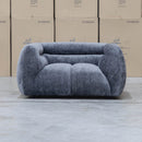 The Fara Curved Fabric Armchair - Steel available to purchase from Warehouse Furniture Clearance at our next sale event.