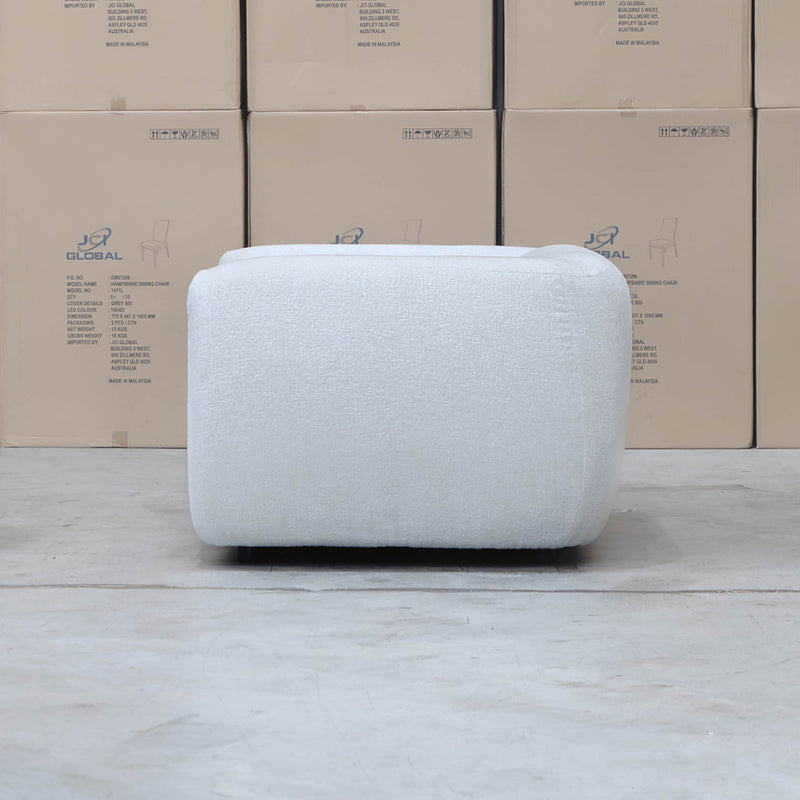 The Fara Curved Fabric Armchair - Cloud available to purchase from Warehouse Furniture Clearance at our next sale event.