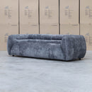 The Fara Curved Fabric Three Seat Sofa - Steel available to purchase from Warehouse Furniture Clearance at our next sale event.