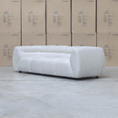 The Fara Curved Fabric Three Seat Sofa - Cloud available to purchase from Warehouse Furniture Clearance at our next sale event.