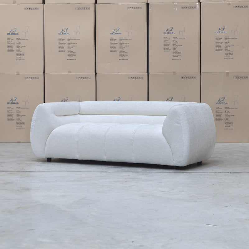 The Fara Curved Fabric Two Seat Sofa - Cloud available to purchase from Warehouse Furniture Clearance at our next sale event.