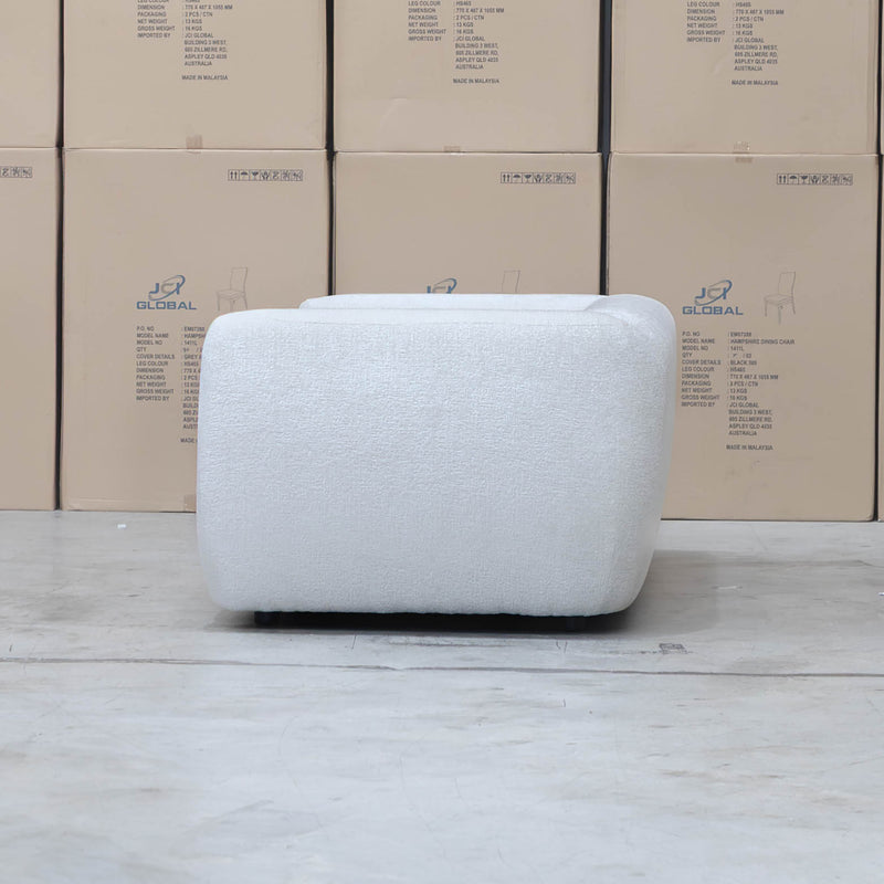 The Fara Curved Fabric Two Seat Sofa - Cloud available to purchase from Warehouse Furniture Clearance at our next sale event.