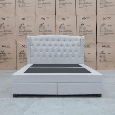The Amelia King Fabric Gas Lift Storage Drawer Bed - Oat White - Available After 10th October available to purchase from Warehouse Furniture Clearance at our next sale event.
