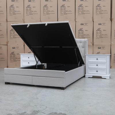 The Amelia King Fabric Gas Lift Storage Drawer Bed - Oat White - Available After 10th October available to purchase from Warehouse Furniture Clearance at our next sale event.