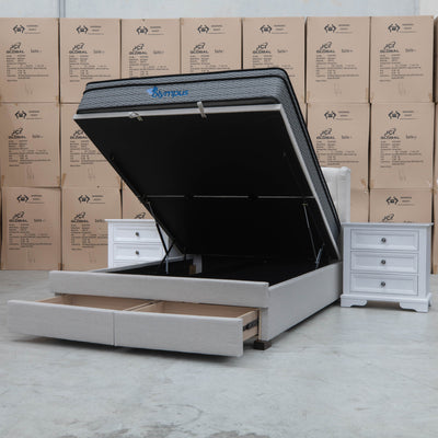 The Amelia King Fabric Gas Lift Storage Drawer Bed - Oat White - Available After 10th October available to purchase from Warehouse Furniture Clearance at our next sale event.