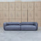 The Harper Curved Fabric Four Seat Sofa - Charcoal available to purchase from Warehouse Furniture Clearance at our next sale event.