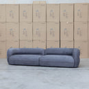 The Harper Curved Fabric Four Seat Sofa - Charcoal available to purchase from Warehouse Furniture Clearance at our next sale event.