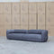 The Harper Curved Fabric Four Seat Sofa - Charcoal available to purchase from Warehouse Furniture Clearance at our next sale event.