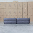 The Harper Curved Fabric Four Seat Sofa - Charcoal available to purchase from Warehouse Furniture Clearance at our next sale event.