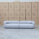 The Harper Curved Fabric Four Seat Sofa - Pewter available to purchase from Warehouse Furniture Clearance at our next sale event.