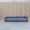 The Harper Curved Fabric Four Seat Sofa - Charcoal available to purchase from Warehouse Furniture Clearance at our next sale event.