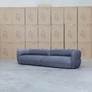 The Harper Curved Fabric Four Seat Sofa - Charcoal available to purchase from Warehouse Furniture Clearance at our next sale event.