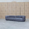 The Harper Curved Fabric Four Seat Sofa - Charcoal available to purchase from Warehouse Furniture Clearance at our next sale event.