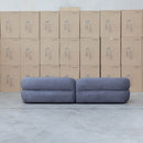 The Harper Curved Fabric Four Seat Sofa - Charcoal available to purchase from Warehouse Furniture Clearance at our next sale event.