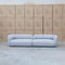 The Harper Curved Fabric Four Seat Sofa - Pewter available to purchase from Warehouse Furniture Clearance at our next sale event.