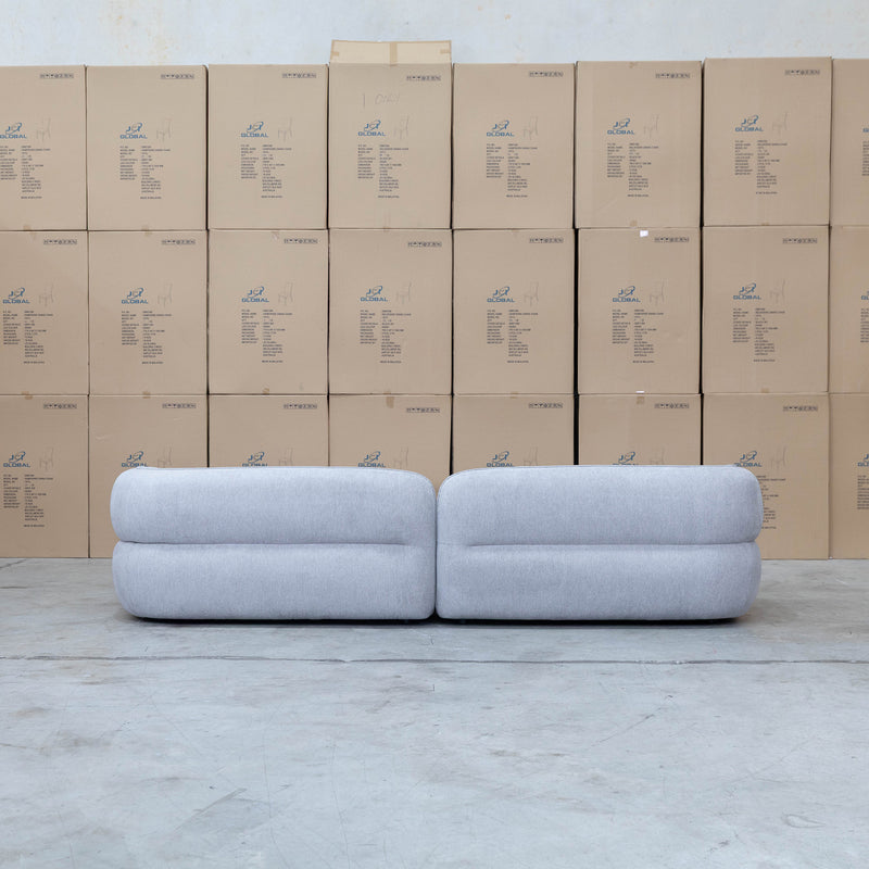 The Harper Curved Fabric Four Seat Sofa - Pewter available to purchase from Warehouse Furniture Clearance at our next sale event.