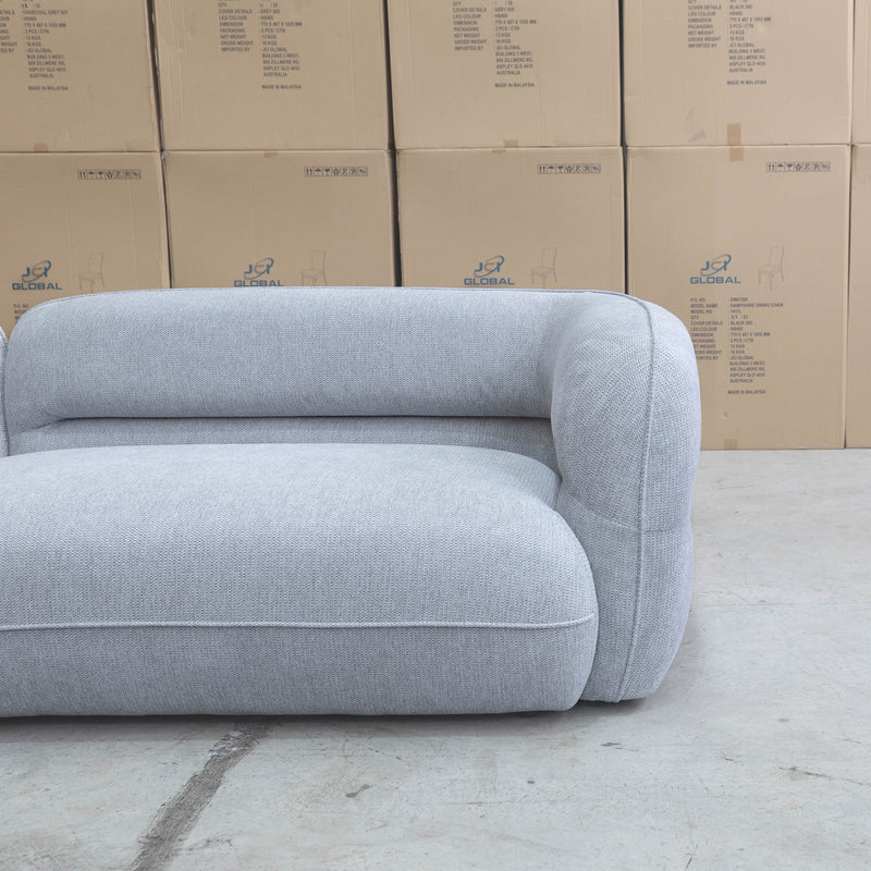 The Harper Curved Fabric Four Seat Sofa - Pewter available to purchase from Warehouse Furniture Clearance at our next sale event.