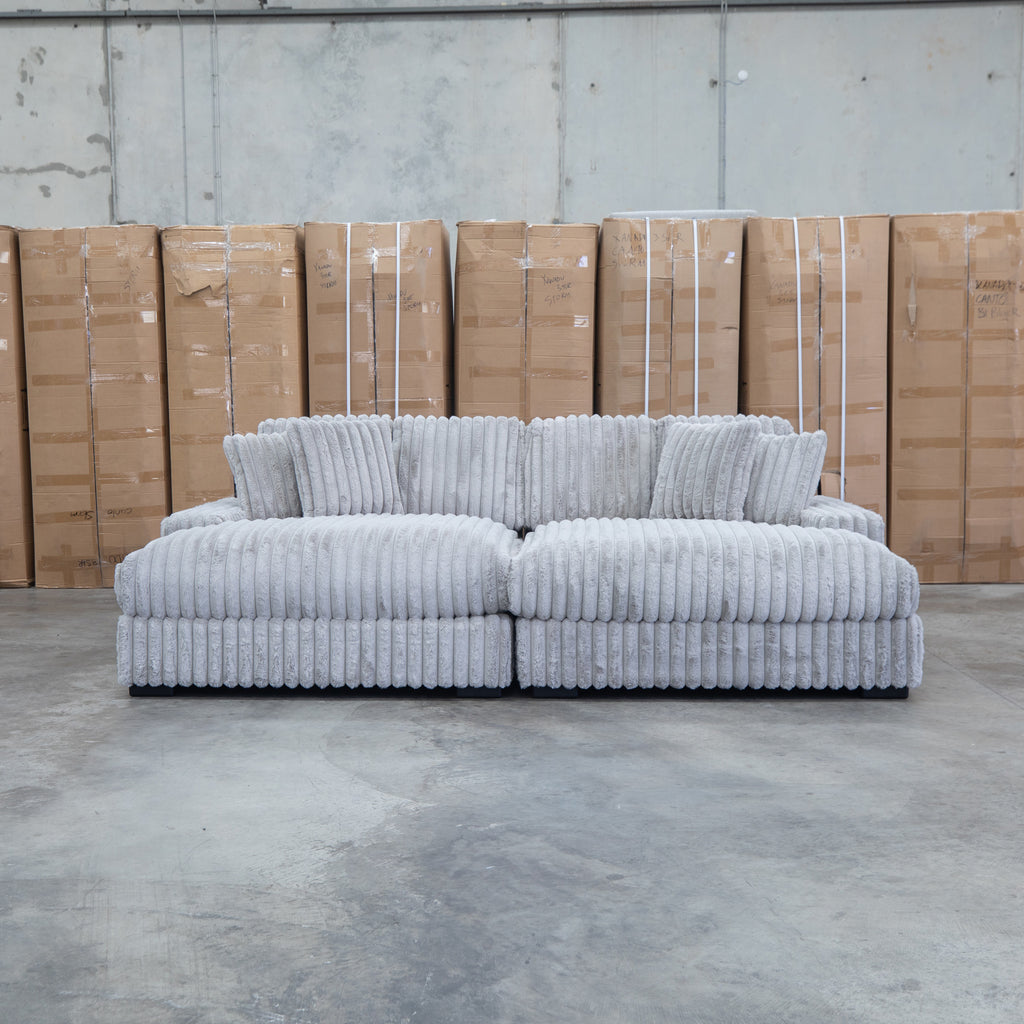 The Kalena Oversized Plush Feather & Foam Double Chaise Lounge - Silver available to purchase from Warehouse Furniture Clearance at our next sale event.