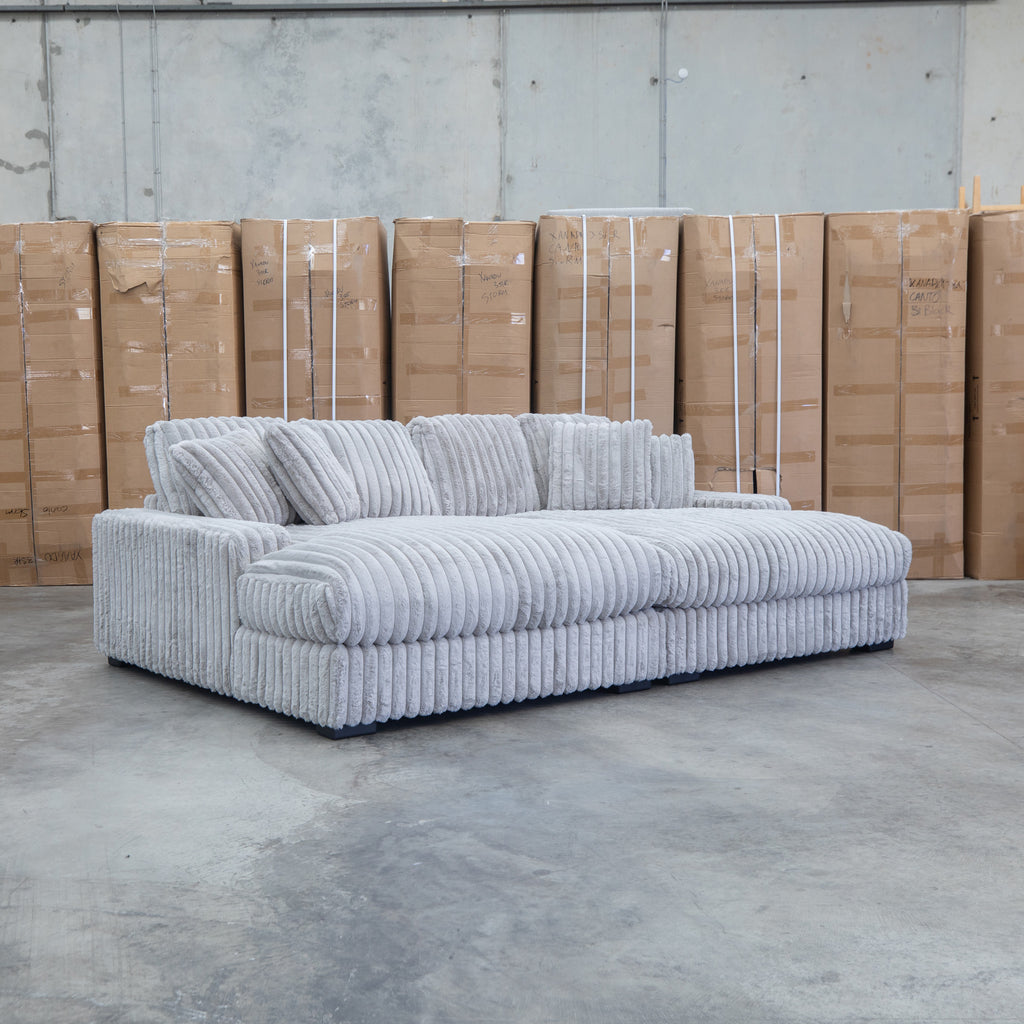 The Kalena Oversized Plush Feather & Foam Double Chaise Lounge - Silver available to purchase from Warehouse Furniture Clearance at our next sale event.
