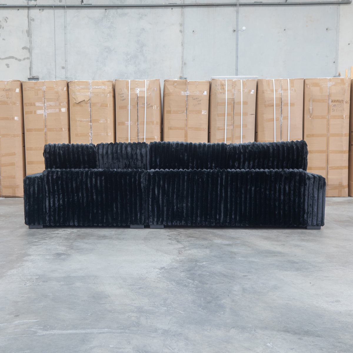 The Kalena Oversized Plush Feather & Foam RHF Chaise Lounge - Black available to purchase from Warehouse Furniture Clearance at our next sale event.