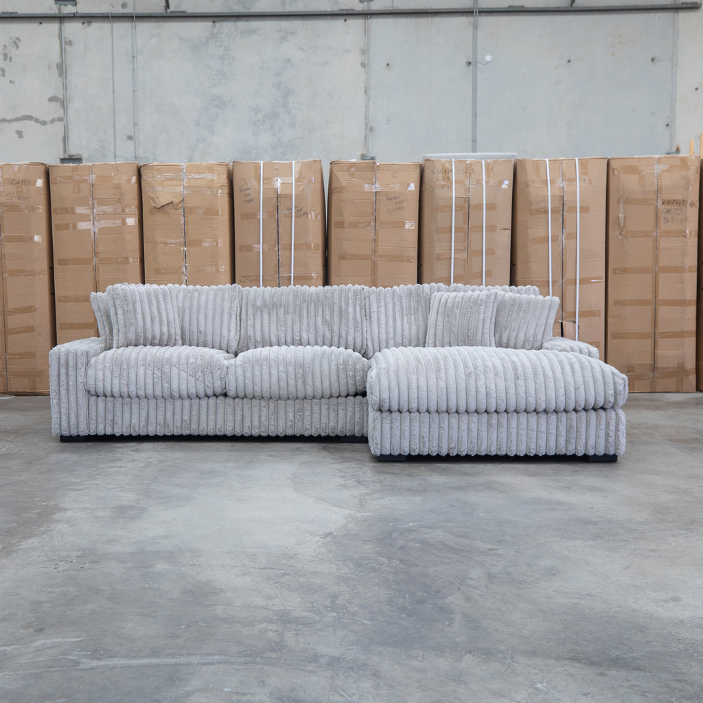 The Kalena Oversized Plush Feather & Foam RHF Chaise Lounge - Silver available to purchase from Warehouse Furniture Clearance at our next sale event.
