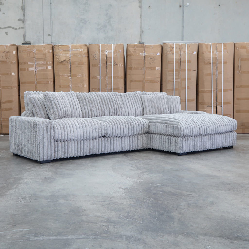 The Kalena Oversized Plush Feather & Foam RHF Chaise Lounge - Silver available to purchase from Warehouse Furniture Clearance at our next sale event.