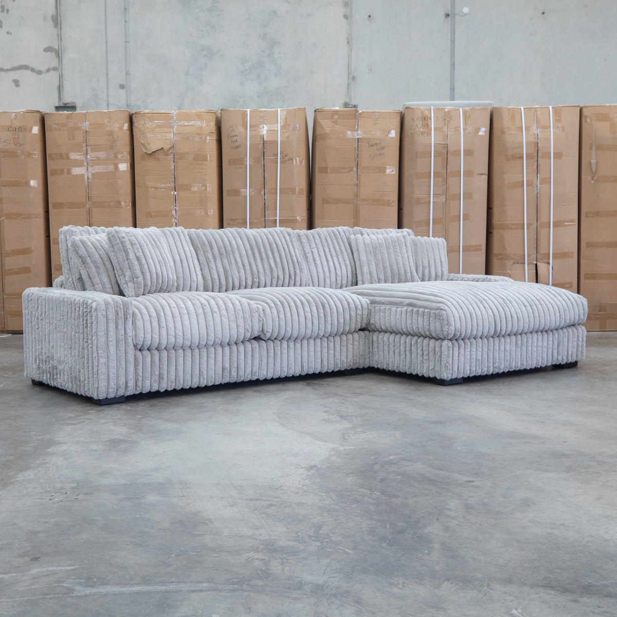The Kalena Oversized Plush Feather & Foam RHF Chaise Lounge - Silver available to purchase from Warehouse Furniture Clearance at our next sale event.