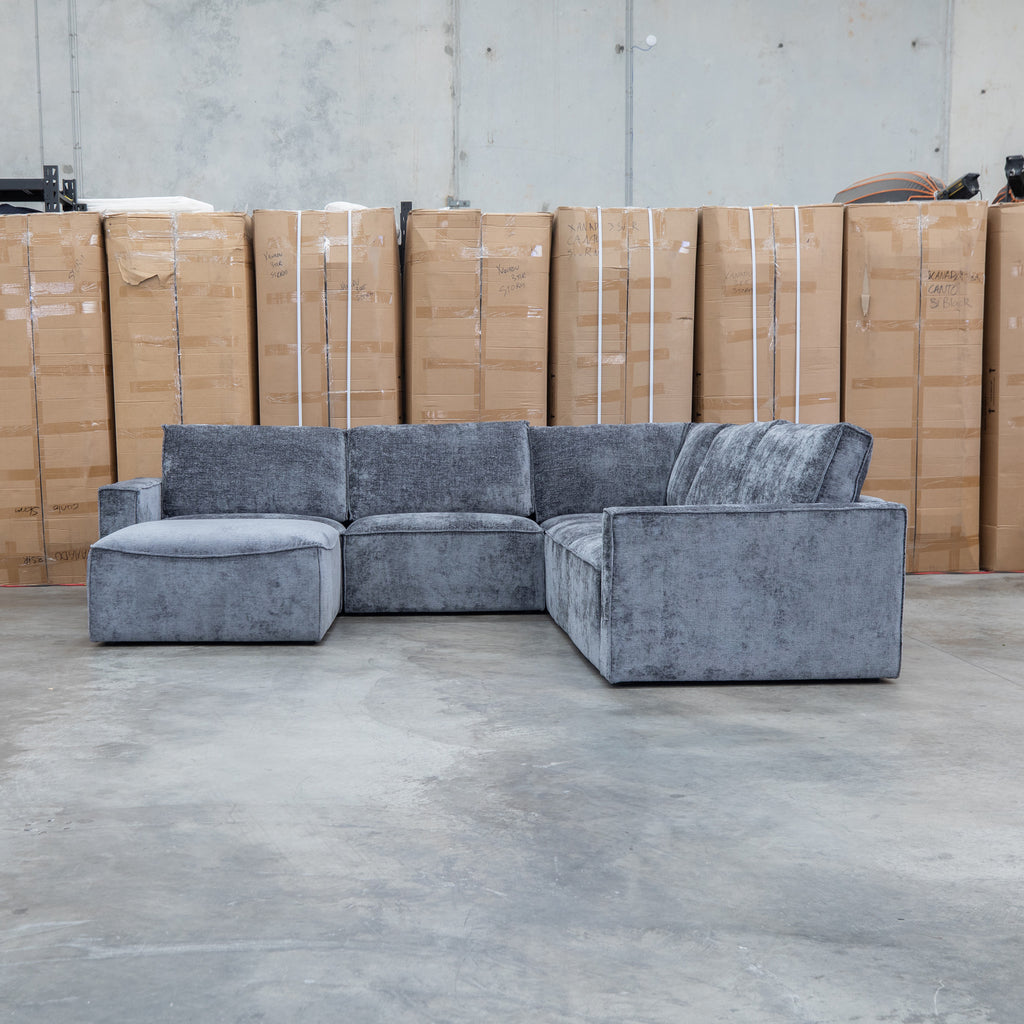 The Layne Modular Corner Lounge with Ottoman - Solo Charcoal available to purchase from Warehouse Furniture Clearance at our next sale event.