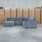 The Layne Modular Corner Lounge with Ottoman - Solo Charcoal available to purchase from Warehouse Furniture Clearance at our next sale event.