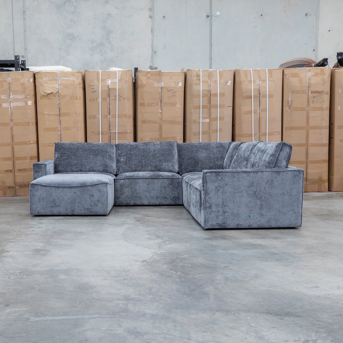 The Layne Modular Corner Lounge with Ottoman - Solo Charcoal available to purchase from Warehouse Furniture Clearance at our next sale event.