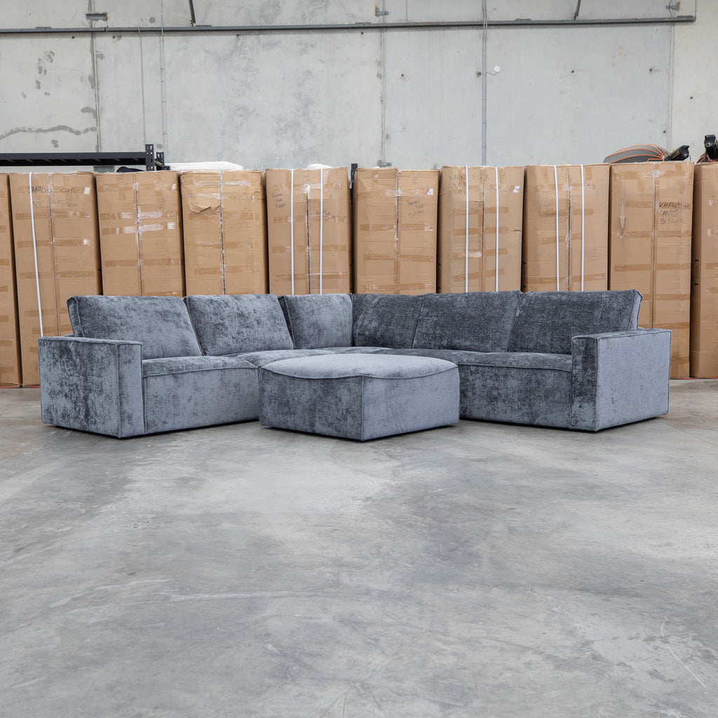 The Layne Modular Corner Lounge with Ottoman - Solo Charcoal available to purchase from Warehouse Furniture Clearance at our next sale event.