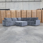 The Layne Modular Corner Lounge with Ottoman - Solo Charcoal available to purchase from Warehouse Furniture Clearance at our next sale event.