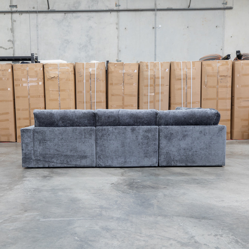 The Layne Modular Corner Lounge with Ottoman - Solo Charcoal available to purchase from Warehouse Furniture Clearance at our next sale event.