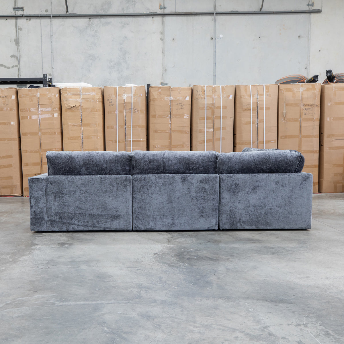 The Layne Modular Corner Lounge with Ottoman - Solo Charcoal available to purchase from Warehouse Furniture Clearance at our next sale event.