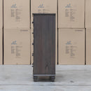 The Library Five Drawer Tallboy - Grey Oak available to purchase from Warehouse Furniture Clearance at our next sale event.