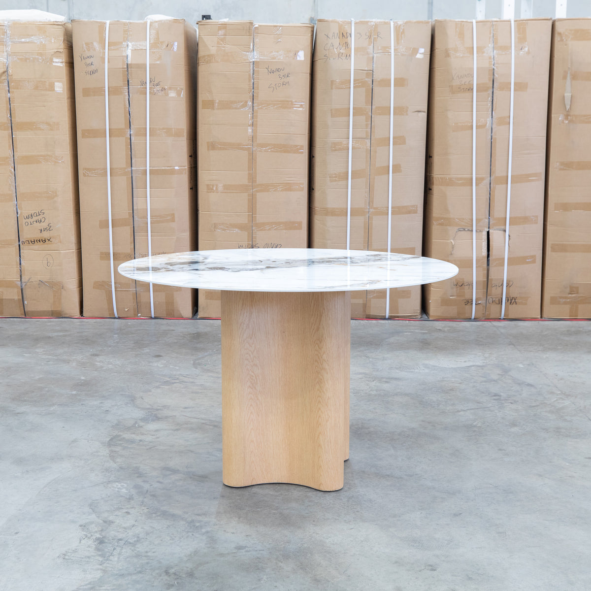 The Lorvani 120cm Round Sintered Stone Dining Table available to purchase from Warehouse Furniture Clearance at our next sale event.