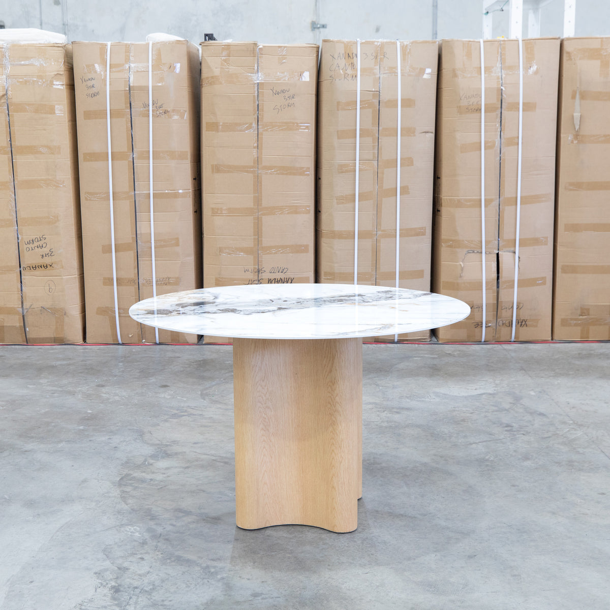 The Lorvani 120cm Round Sintered Stone Dining Table available to purchase from Warehouse Furniture Clearance at our next sale event.