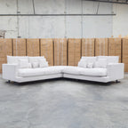 The Melbourne Deep Seat Feather & Foam Modular Corner Lounge - Biscuit available to purchase from Warehouse Furniture Clearance at our next sale event.
