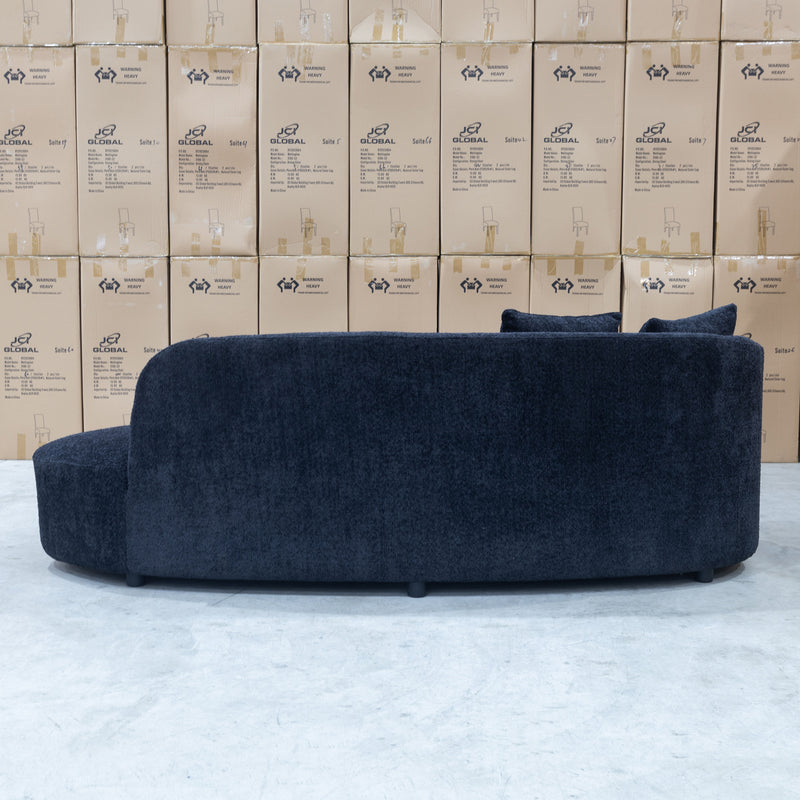 The Santorini Curved Boucle Chaise - Black Boucle Fabric available to purchase from Warehouse Furniture Clearance at our next sale event.