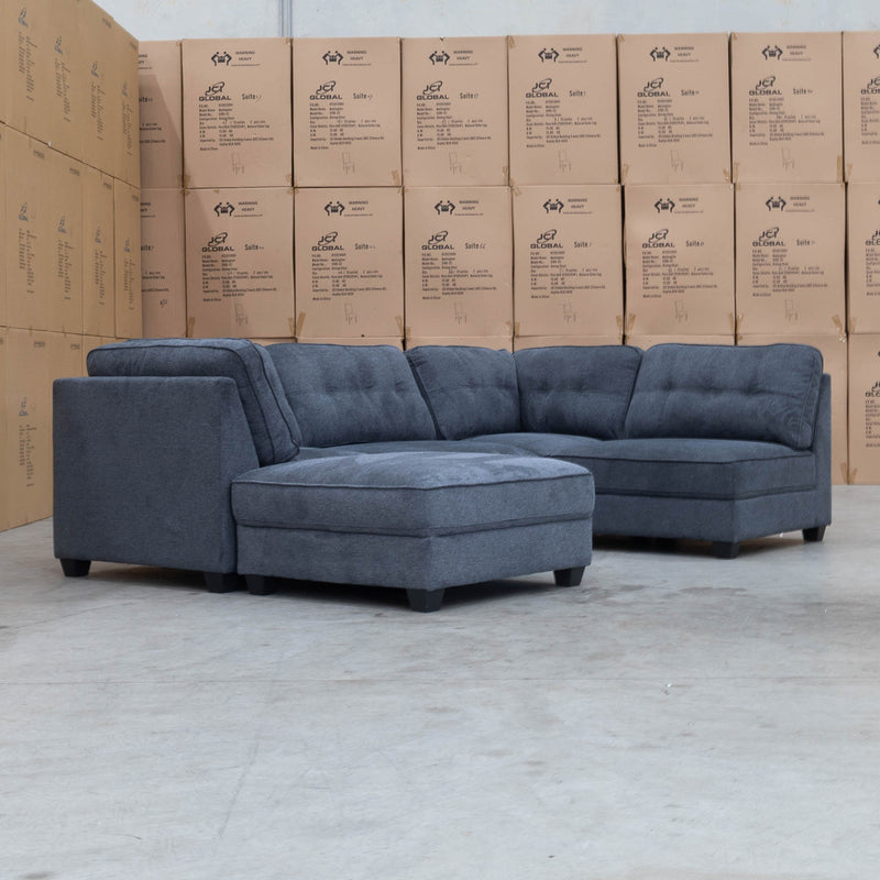 The Malta Modular Corner Lounge with Accent Ottoman - Charcoal available to purchase from Warehouse Furniture Clearance at our next sale event.