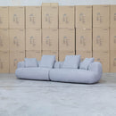 The Maven Curved Fabric Four Seat Sofa - Pewter available to purchase from Warehouse Furniture Clearance at our next sale event.