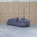 The Maven Curved Fabric Four Seat Sofa - Charcoal available to purchase from Warehouse Furniture Clearance at our next sale event.