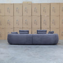 The Maven Curved Fabric Four Seat Sofa - Charcoal available to purchase from Warehouse Furniture Clearance at our next sale event.