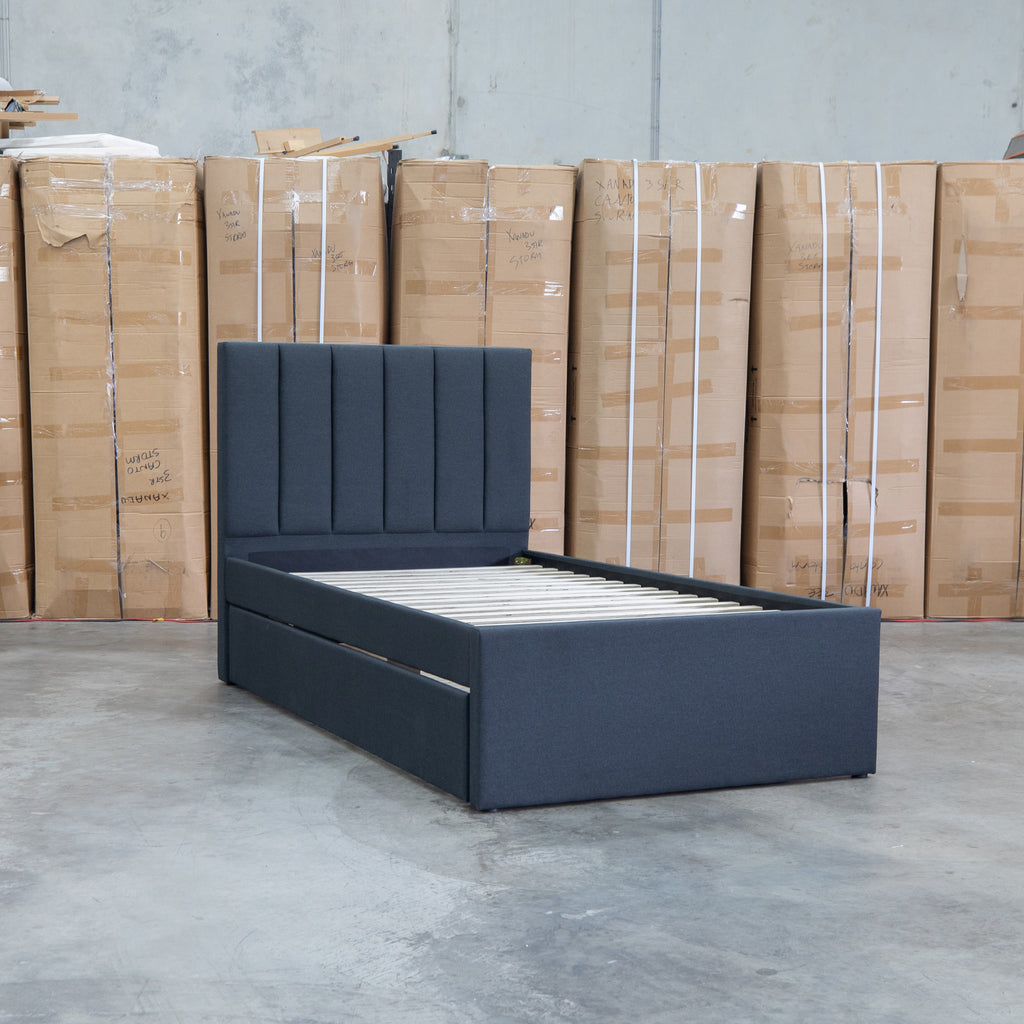 The Medford King Single Fabric Trundle Bed - Charcoal (Reversible Trundle) available to purchase from Warehouse Furniture Clearance at our next sale event.