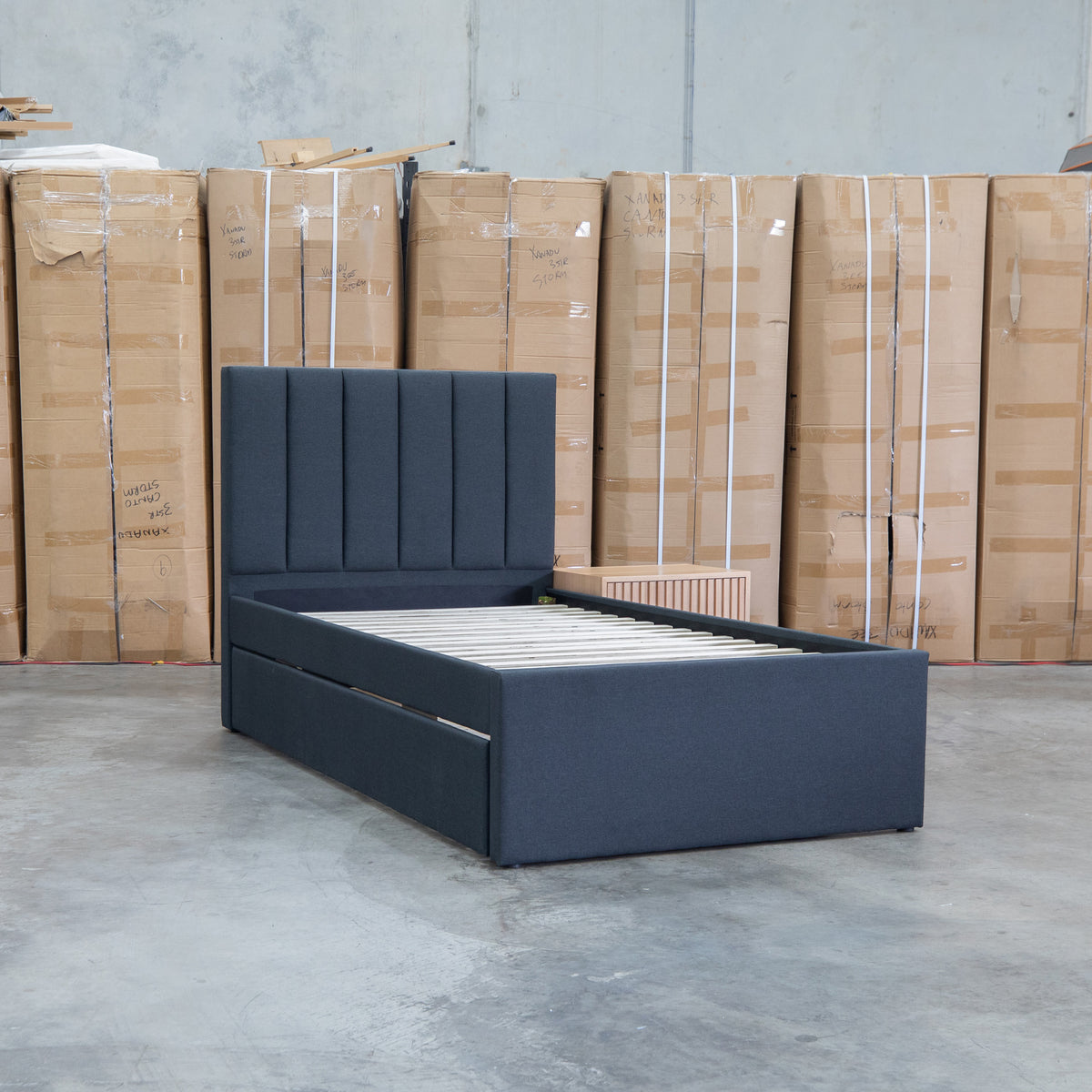 The Medford King Single Fabric Trundle Bed - Charcoal (Reversible Trundle) available to purchase from Warehouse Furniture Clearance at our next sale event.