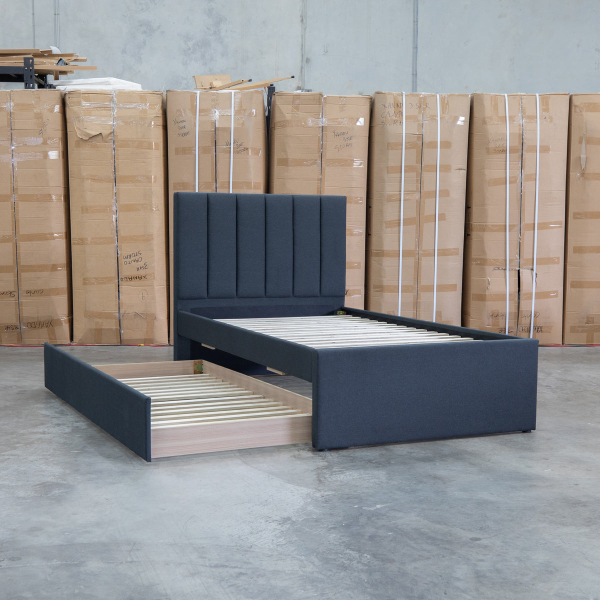 The Medford King Single Fabric Trundle Bed - Charcoal (Reversible Trundle) available to purchase from Warehouse Furniture Clearance at our next sale event.