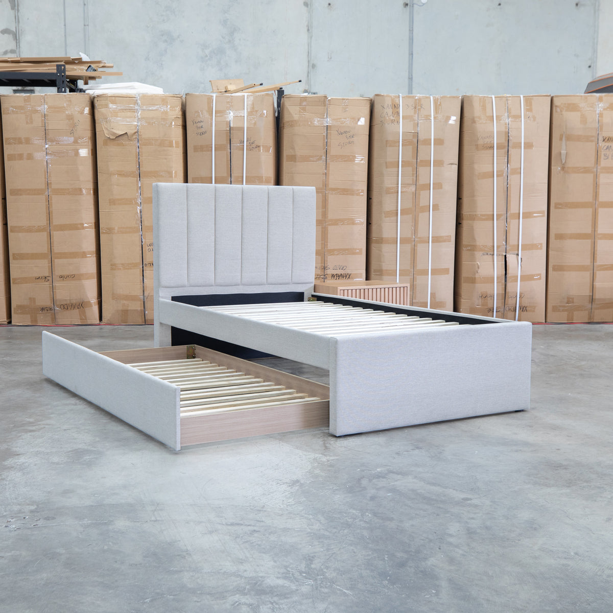 The Medford King Single Fabric Trundle Bed - Oat White (Reversible Trundle) available to purchase from Warehouse Furniture Clearance at our next sale event.