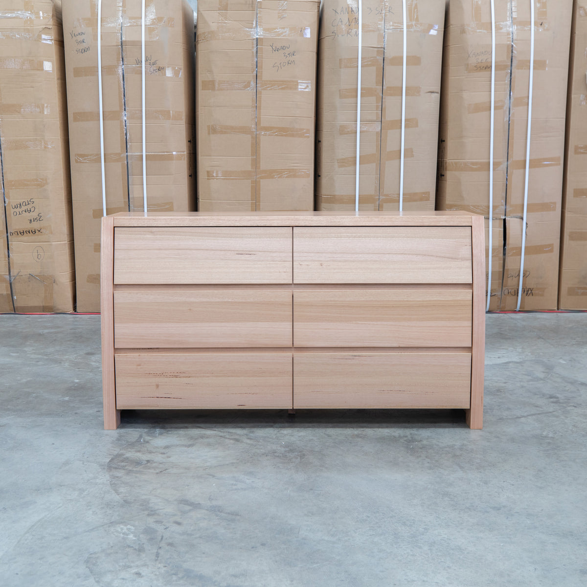 The Melba Curved Australian Messmate Six Drawer Dresser available to purchase from Warehouse Furniture Clearance at our next sale event.