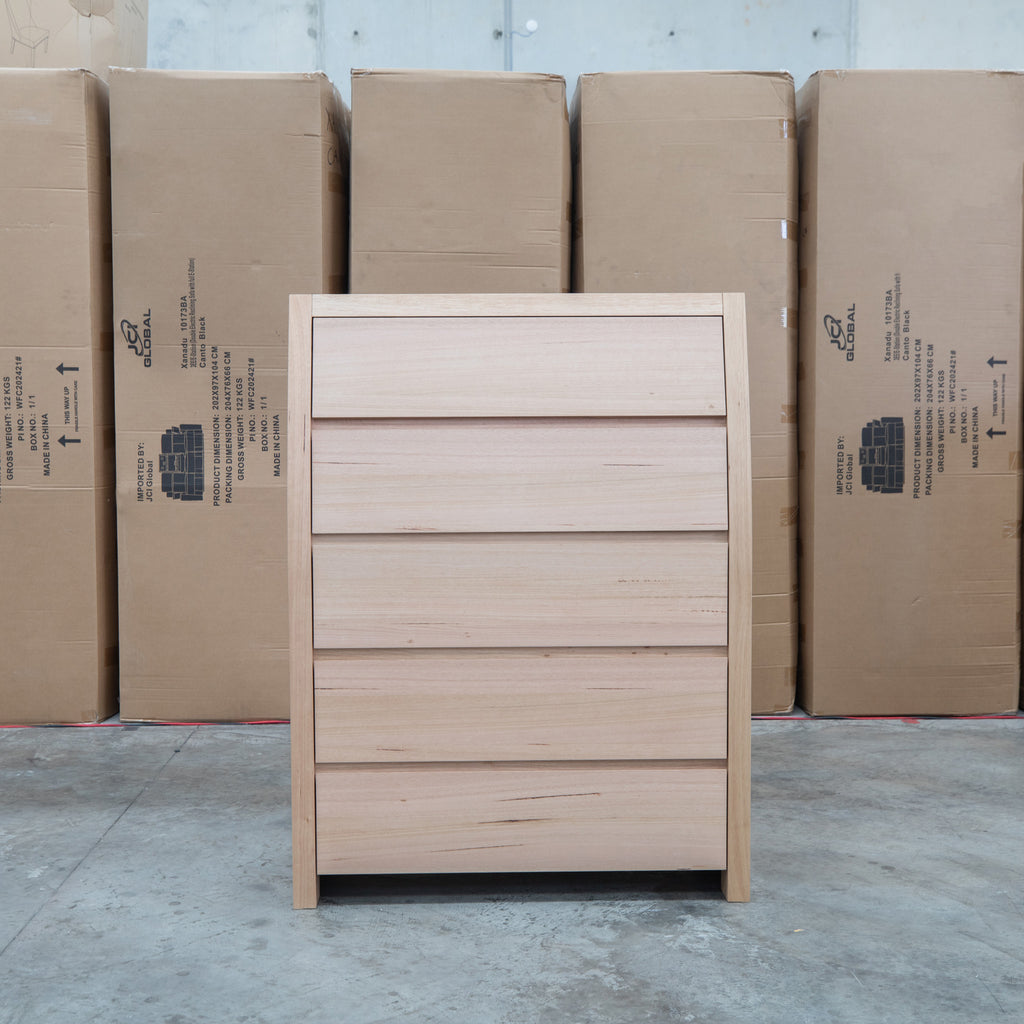 The Melba Curved Australian Messmate Five Drawer Tallboy available to purchase from Warehouse Furniture Clearance at our next sale event.